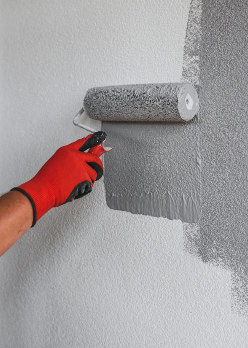 paint-roller-with-grey-paint Experienced painting contractors in Durham transforming homes – Steve Biddy Painting